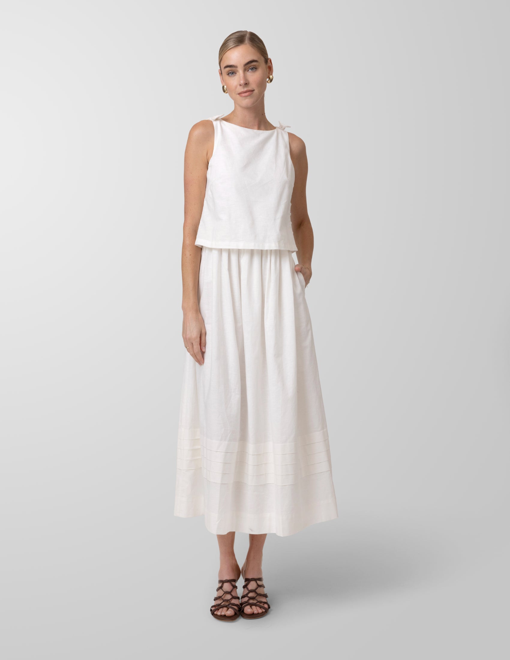 a line white midi dress Azazie 2026 Graduation line%20design%0D%0AConcealed%20zipper%20at%20back%0D%0AGentle%20Dry%20Clean%20Only%0D%0ALength%3A%20Midi La Ligne | Andie Dress